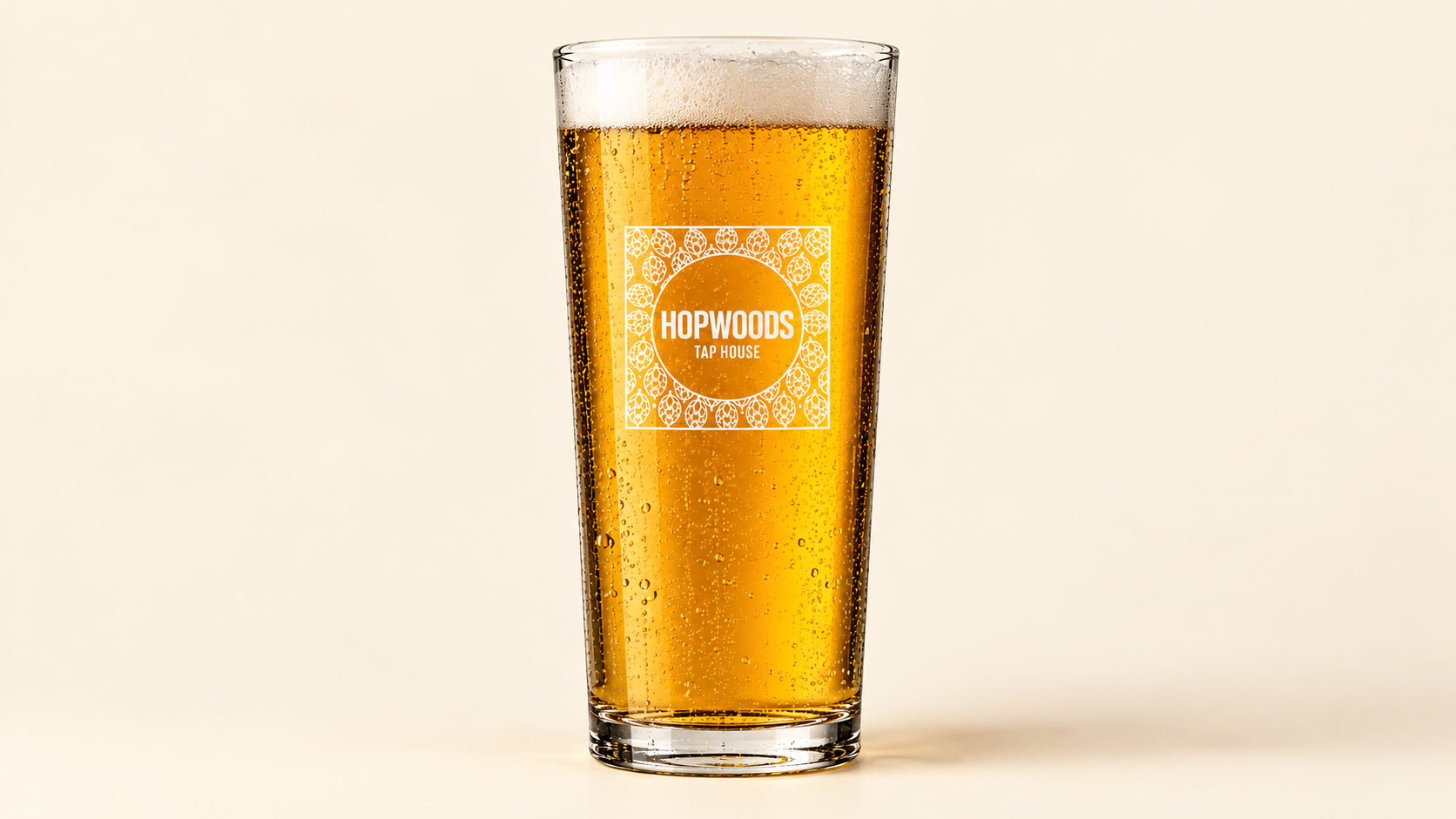 A branded pint of lager at Hopwoods Tap House