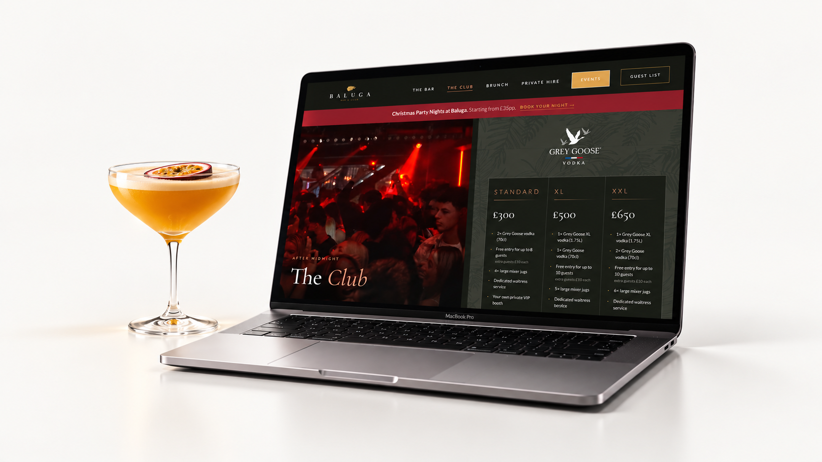 Baluga Bar and Club brand and website on a studio desk